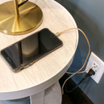 iphone charging by bedside usb charging outlet