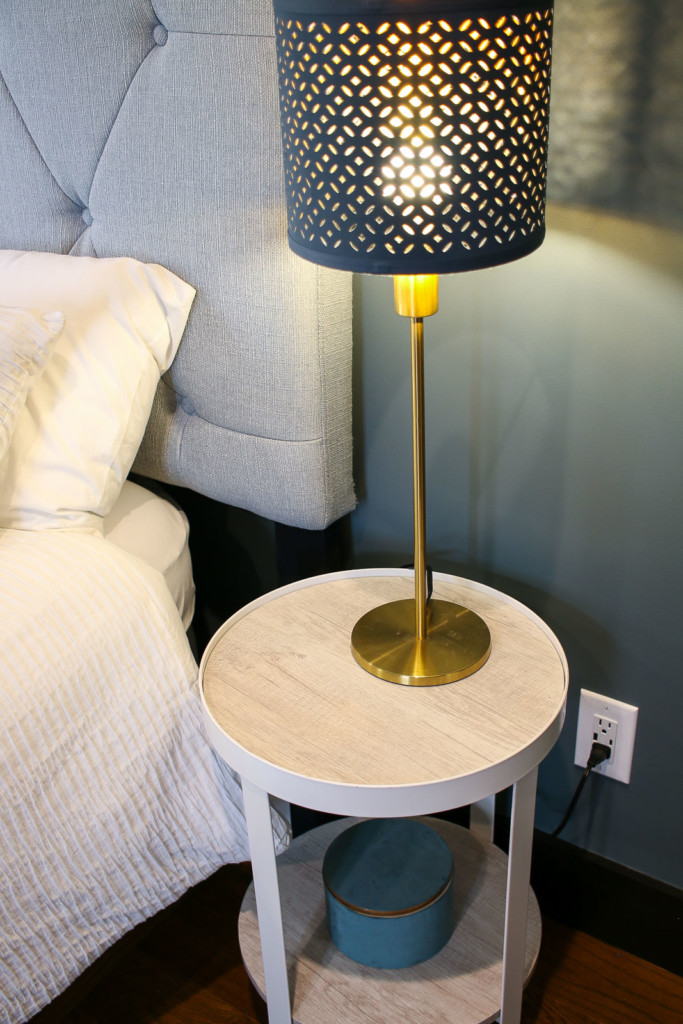 usb charging outlet next to bedside table in master bedroom