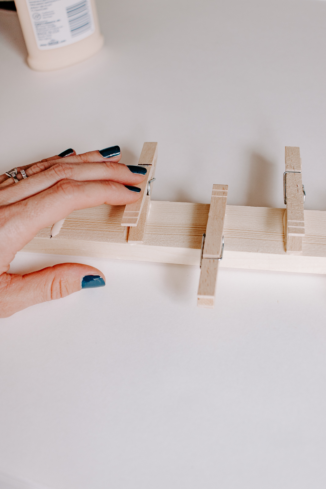 glue clothespins to scrap wood