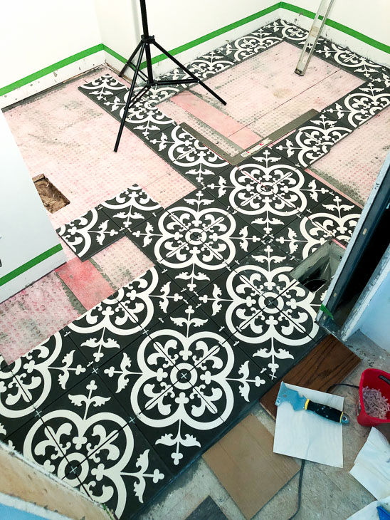 Dry run. Layout cement tiles before installation
