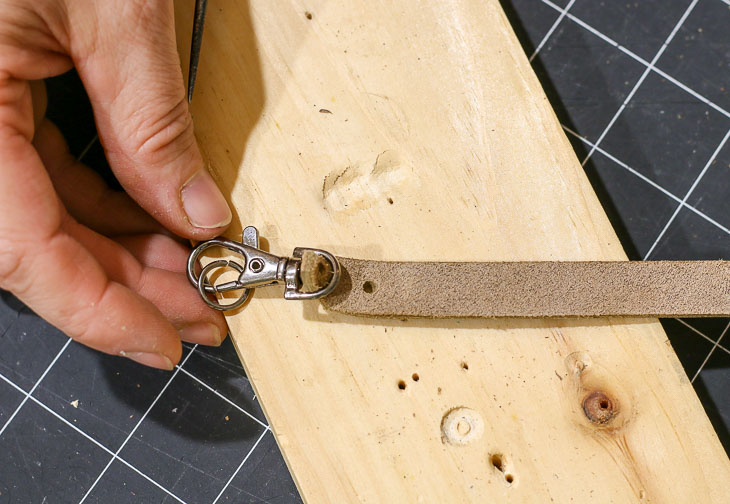 insert clasp into leather band