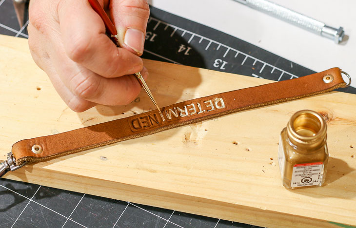 painting gold letters on leather bracelet