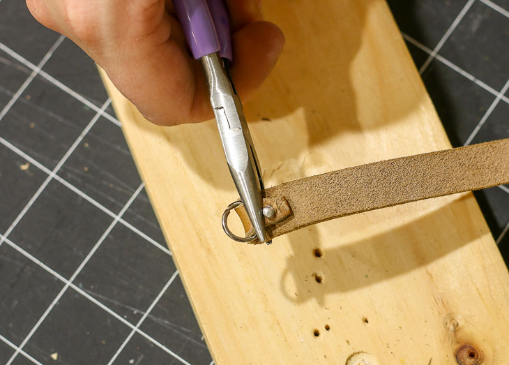 squeeze band over rivet with plyers