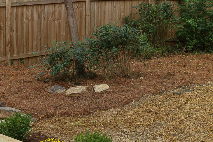 three pier stones from original house used as landscaping rocks