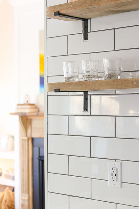 White subway backsplash open reclaimed wood shelving