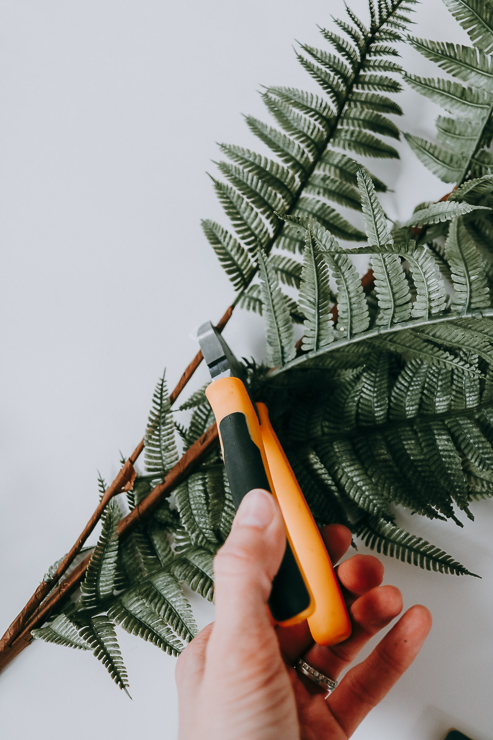 Snip off individual greens and leaves before attaching to your wreath