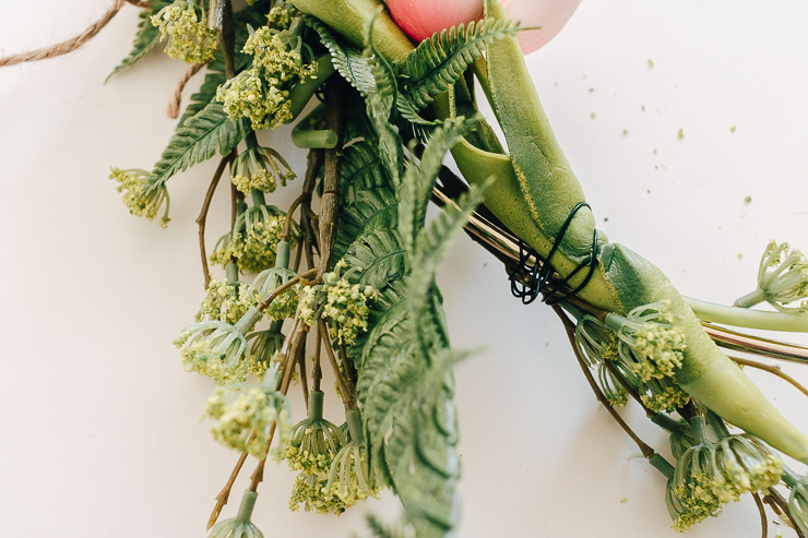 Attach your greenery and accent florals using green floral wire.