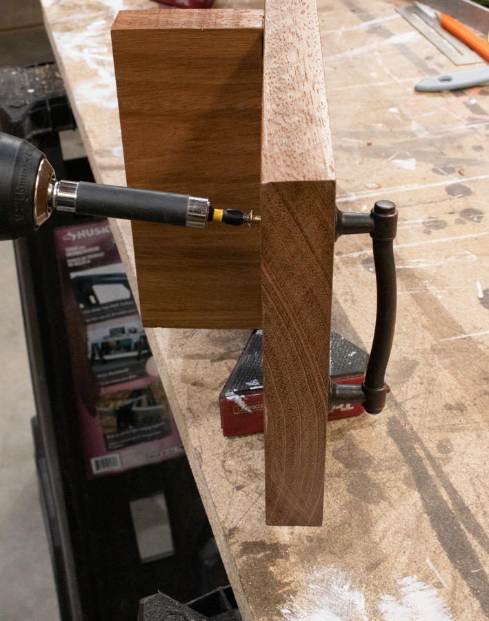 Attach handles through drilled holes in tray