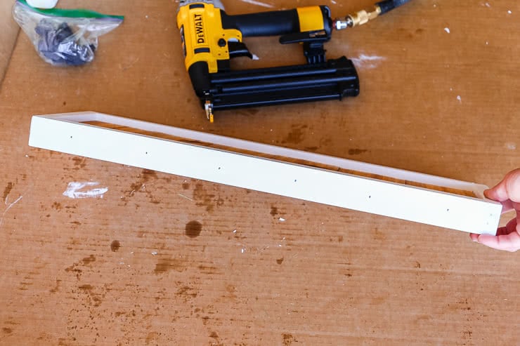 attaching cedar to house number sign