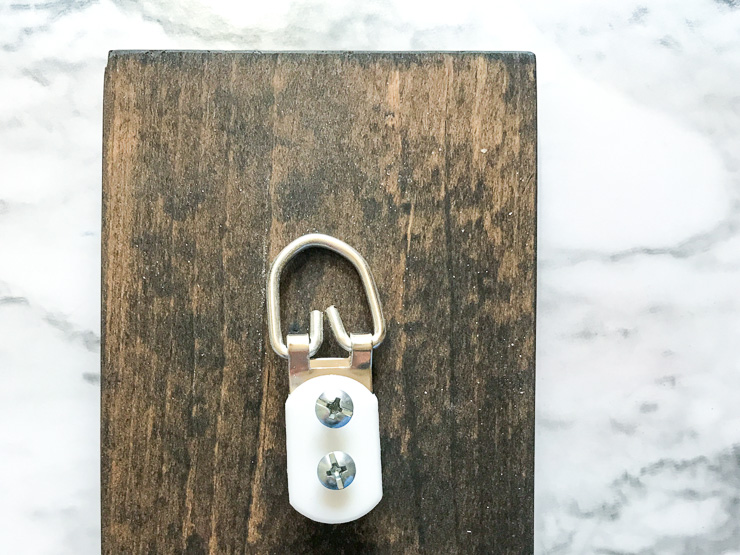 add a d-ring to the back to hang