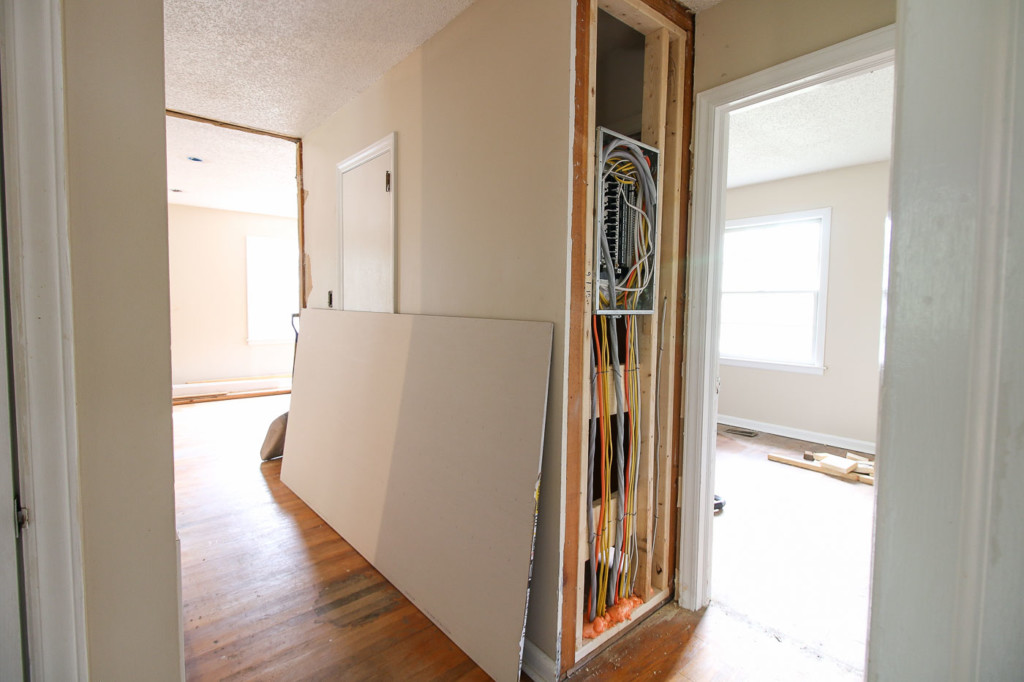 angled view of new electrical sub panel and view down hallway