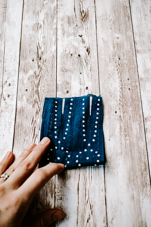 Fold fabric in half
