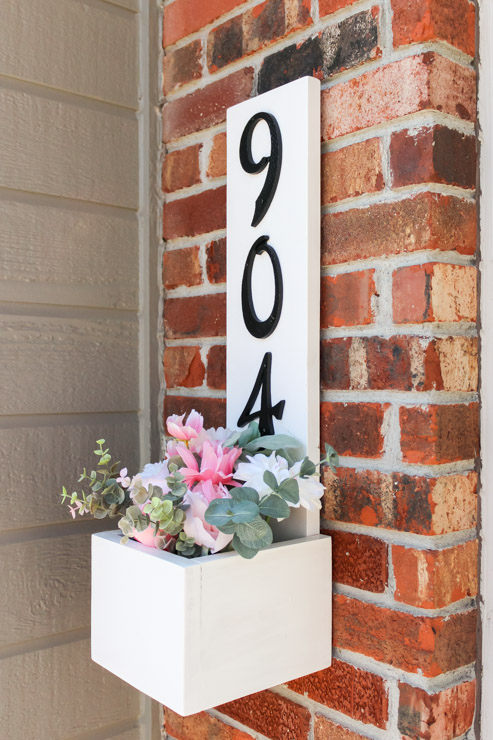 Finished view of house number planter box, filled with Spring florals