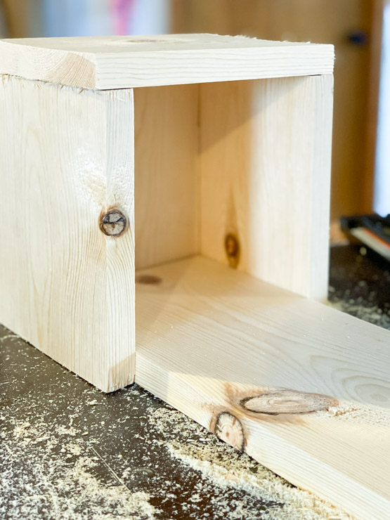 attach sides and front pieces of wood to complete the planter box