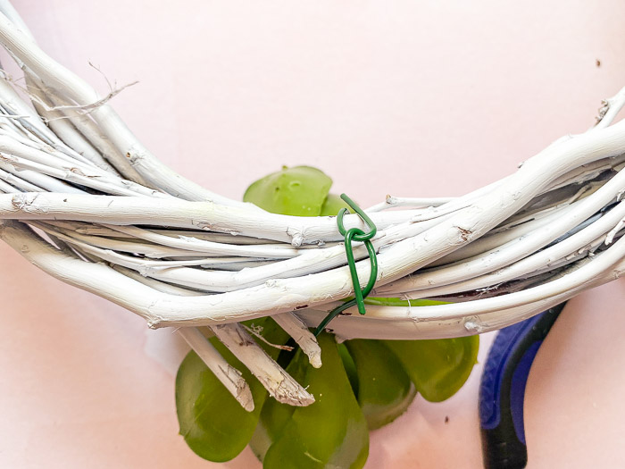 wrap floral wire around grapevine wreath form to secure