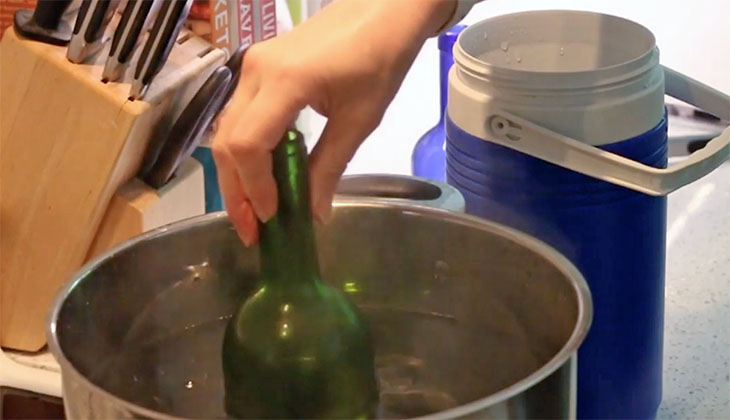 wine bottle in hot water