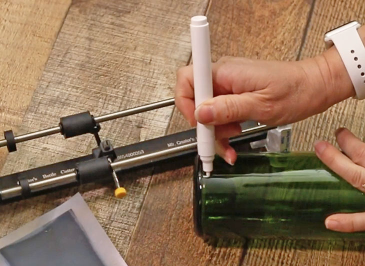 mark bottom of wine bottle with white paint pen