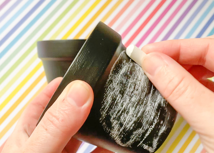 prepping chalkboard pot surface with chalk