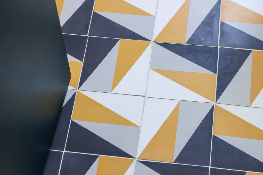 Lili Cement Tile Vegas3 houndstooth pattern gold and black tiles