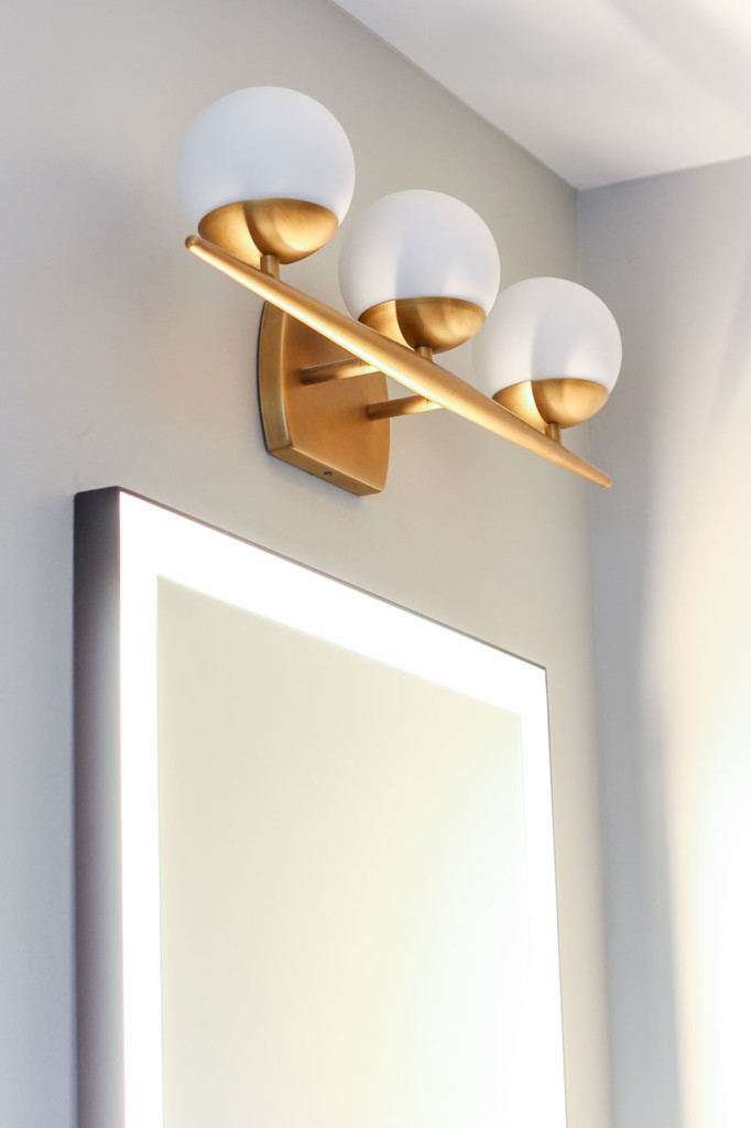 Kichler Jasper Light Fixture and lit mirror