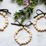finished wooden bead ornaments on greenery