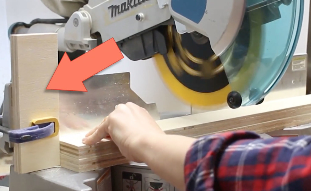 stop block clamped to miter saw fence
